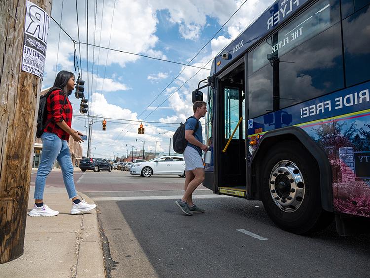 Students boarding The Flyer bus